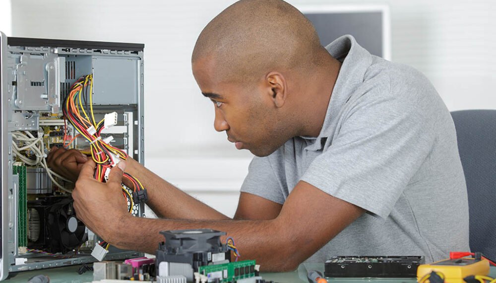 Man working on computer internals