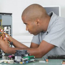 Man working on computer internals